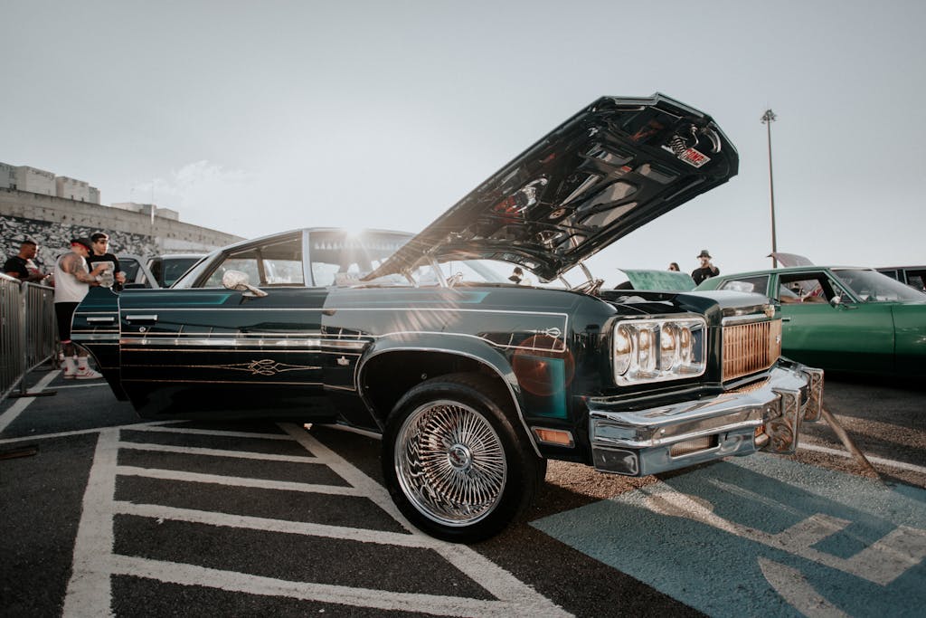A classic vintage car with open hood displayed outdoors in São Paulo, Brazil.